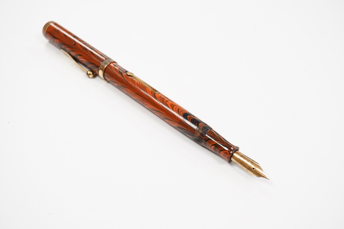 A Waterman Red Ripple No.7 lever filler with yellow cap band and fitted with a Waterman nib